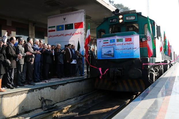 Iranian officials applaud on the platform as the first train connecting China and Iran arrives at Tehran Railway Station on Monday. Photo: AFP
